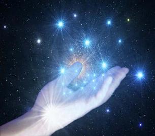 Hand holding cosmic starseeds